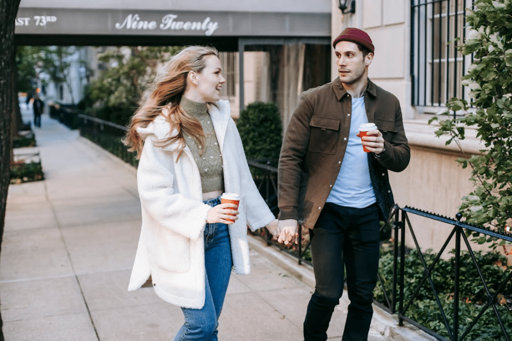 Happy young couple walking on street