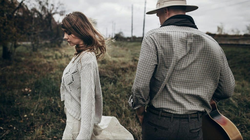 Woman walking away from man