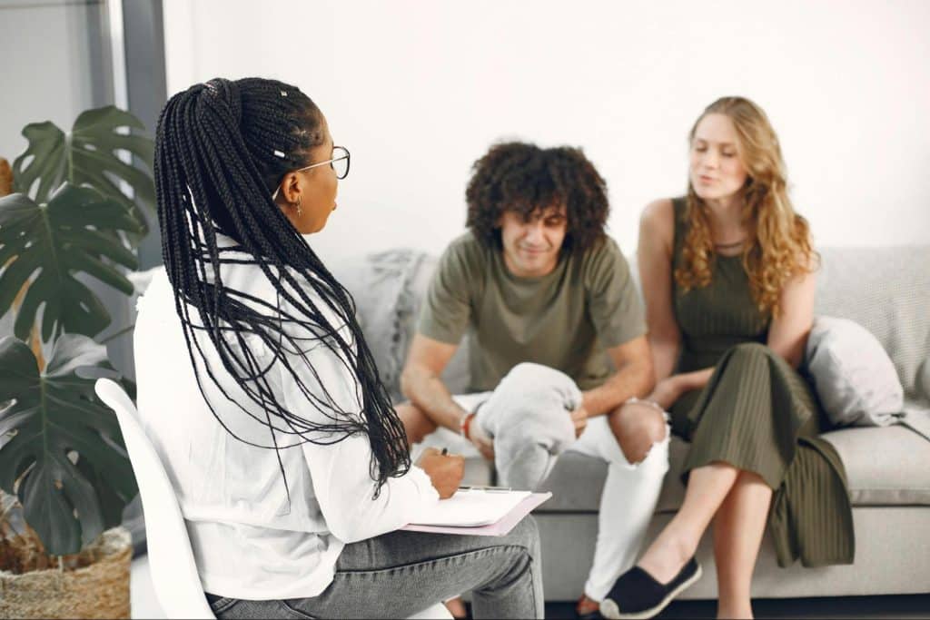 A man and woman with their therapist
