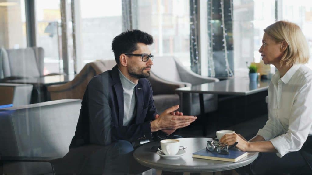 A man and woman talking