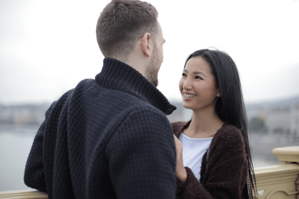 Happy Couple Standing on the Bridge
