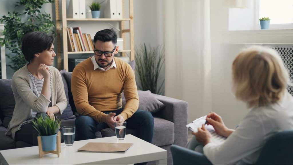 A woman talking to a man