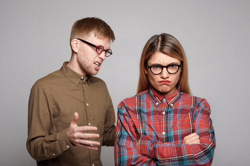 Couple in glasses having disagreements