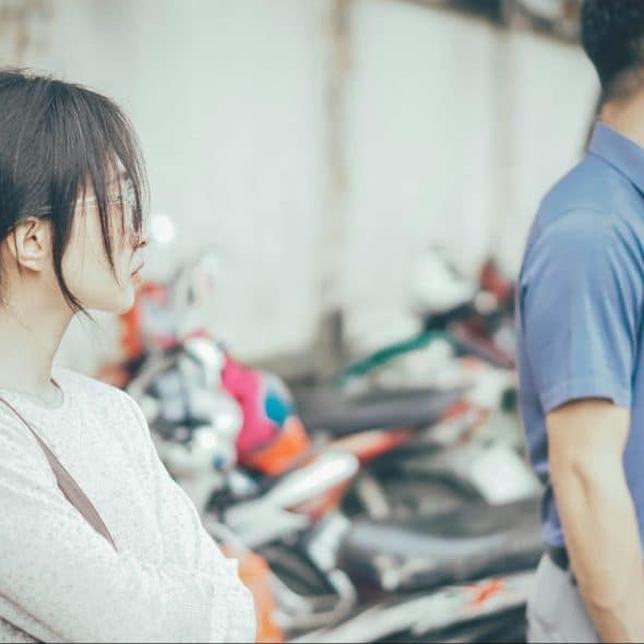 A man and woman being distant from each other