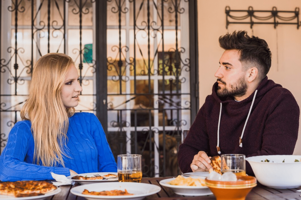 Couple having lunch on backyard