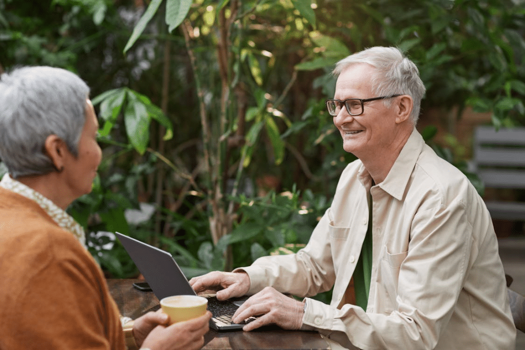 Man smiling while looking at woman in conversation
