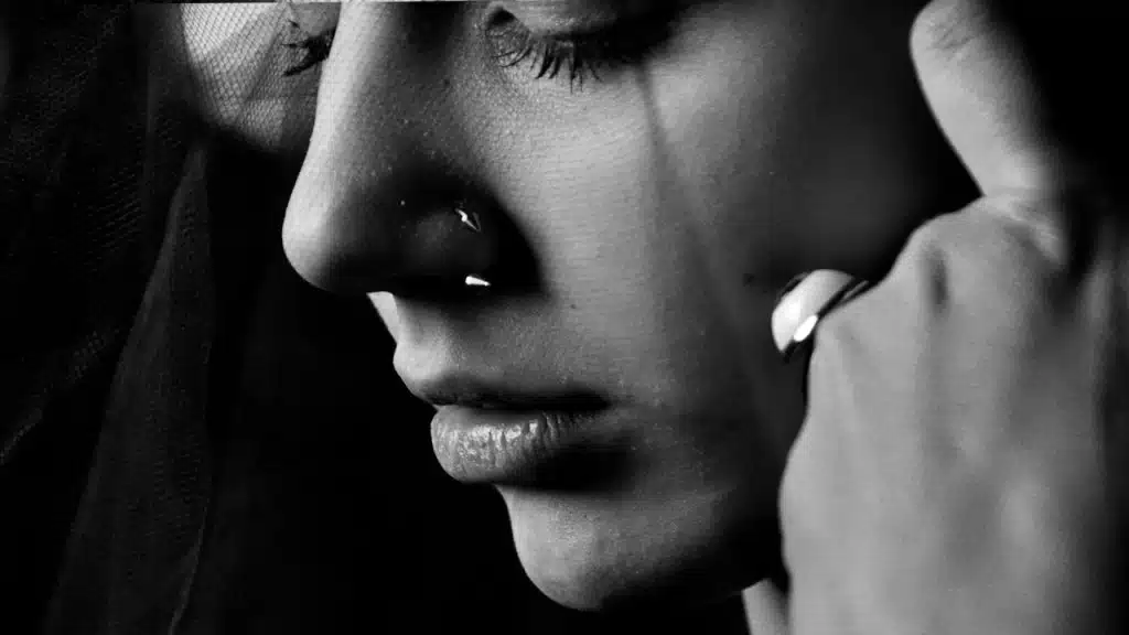 A closeup of a woman crying.
