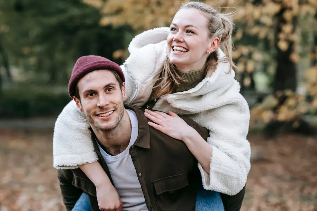 Cheerful young couple hugging and having fun