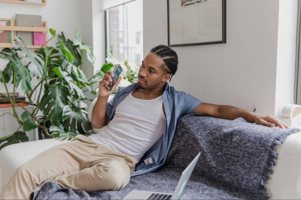 A man sitting alone at the sofa