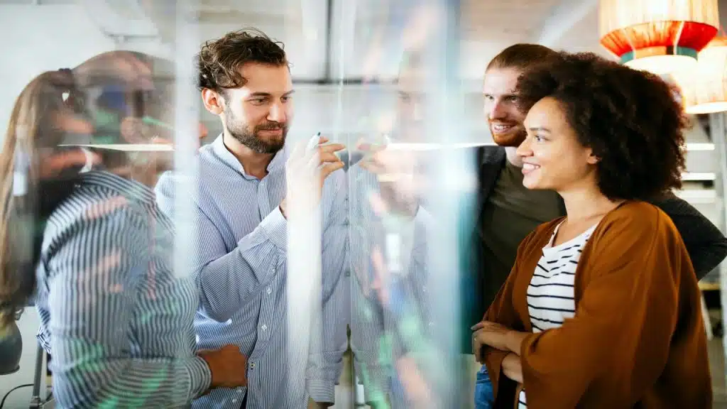 Colleagues having a meeting while smiling