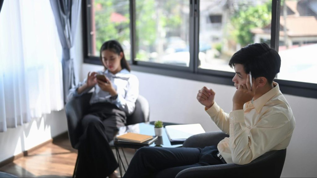 A man and woman busy working