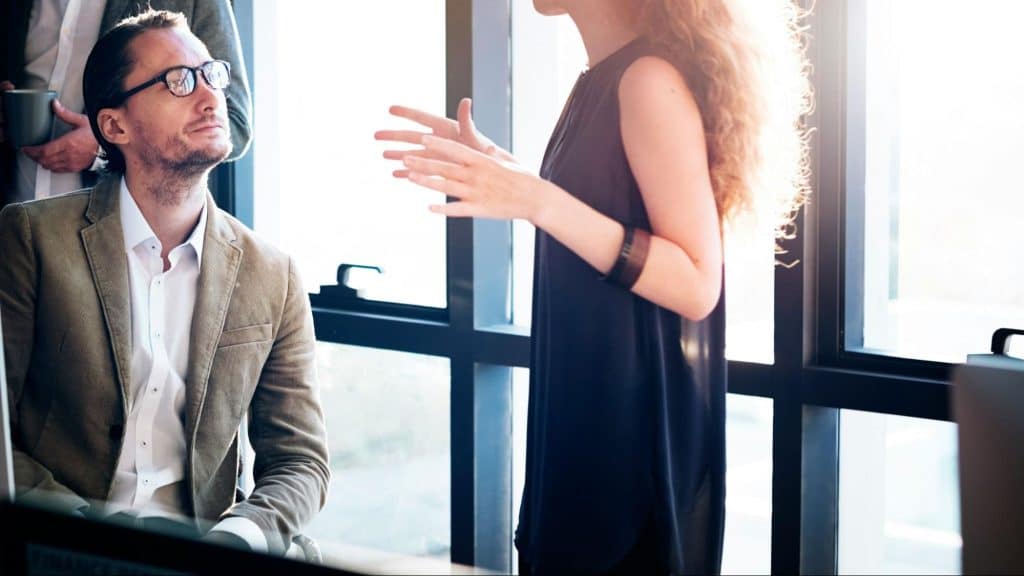 Woman talking to a man