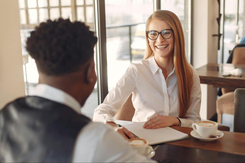 Woman smiling to a man