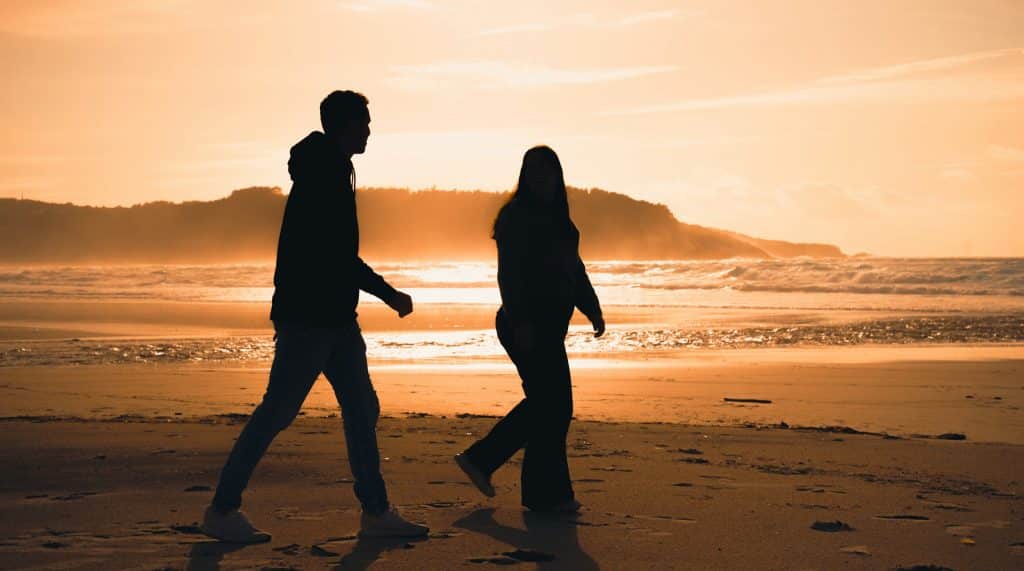 couple walking separately