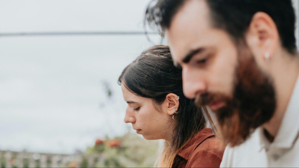 A man and woman serious with their work