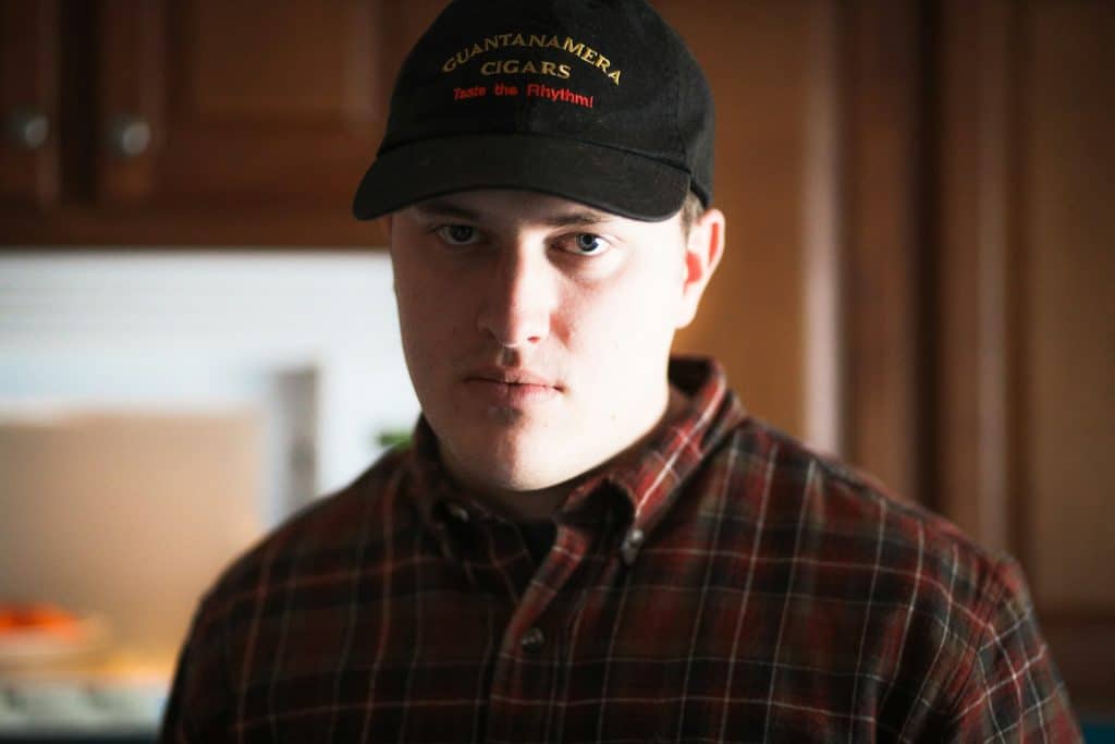 Alt text: man neutral expression