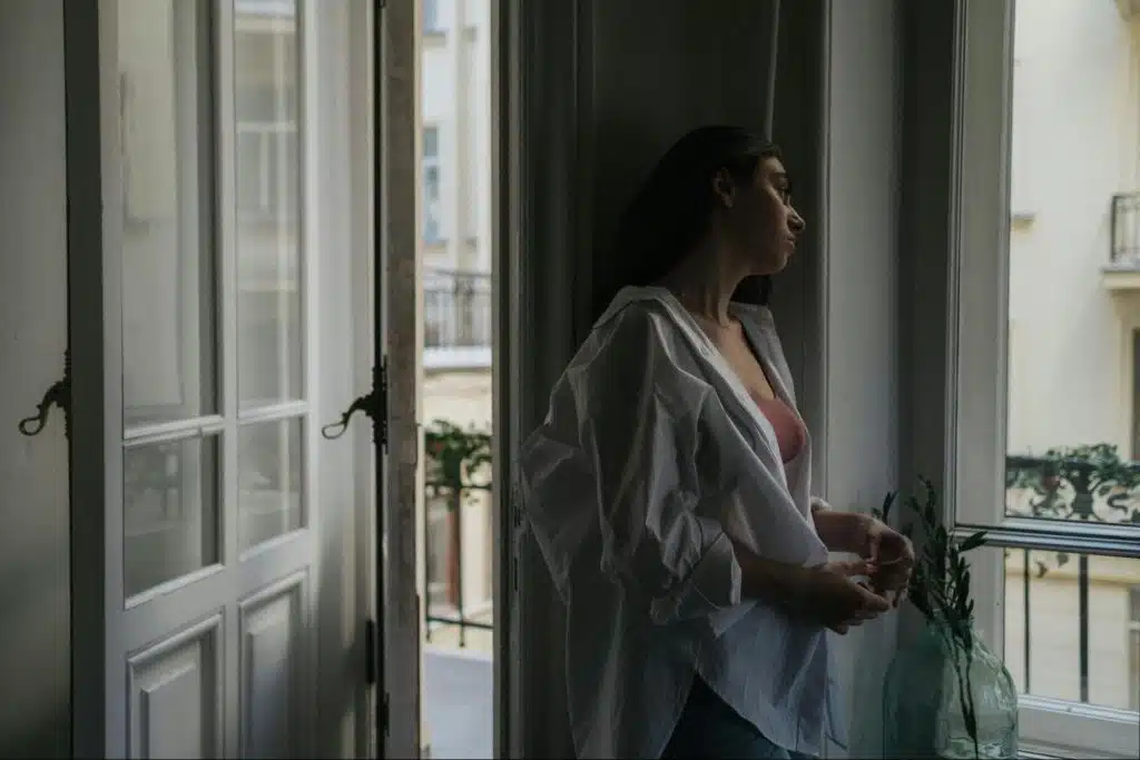 Woman looking at the window