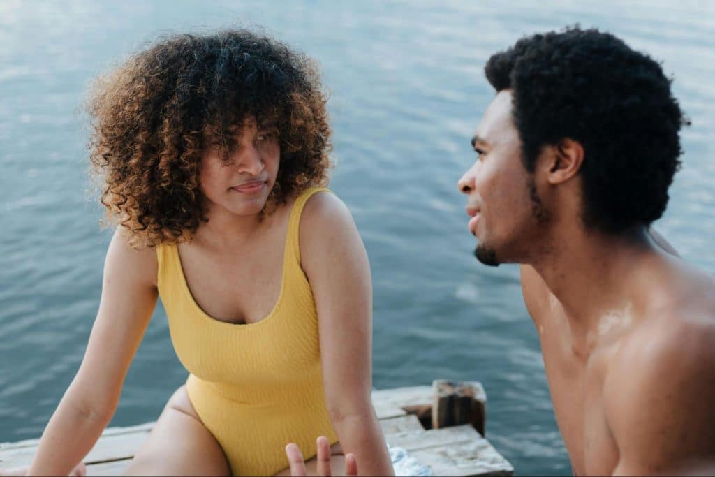 A woman listening to a man