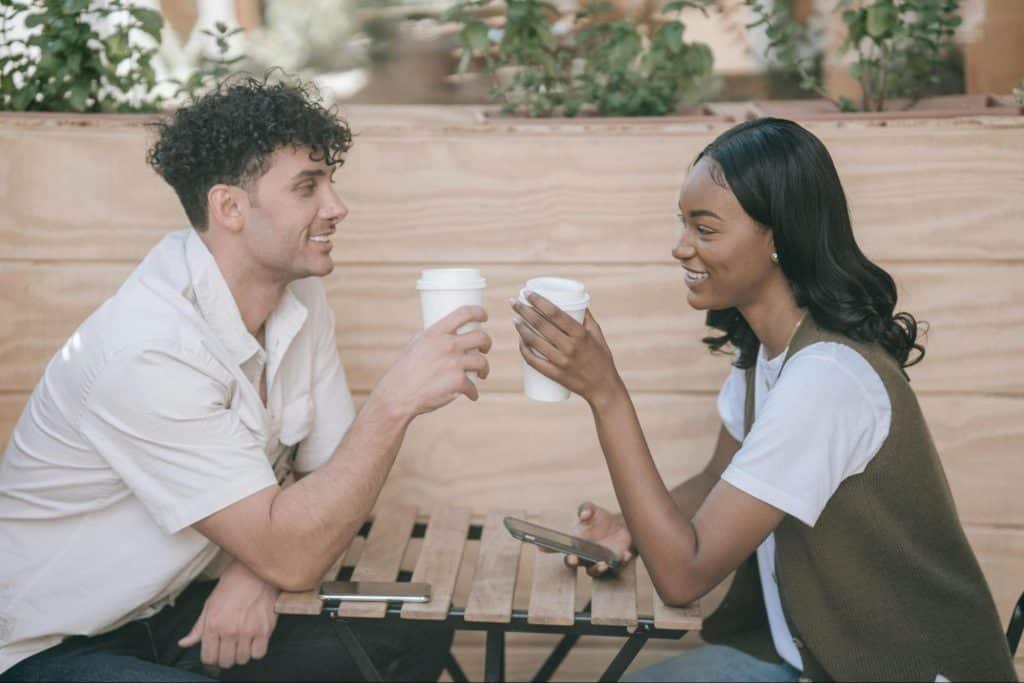 A man and woman smiling at each other