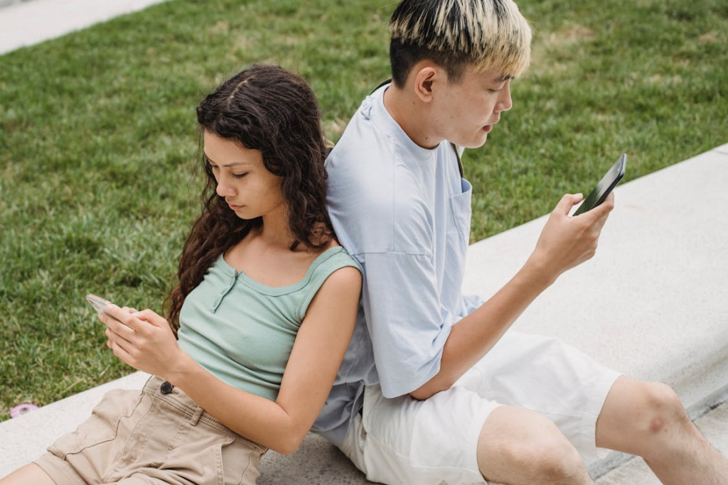 Couple browsing internet on smartphones