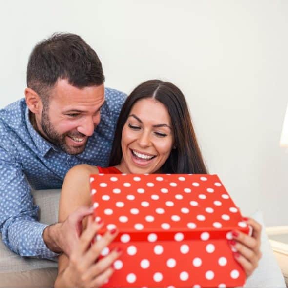 A man giving gift to woman