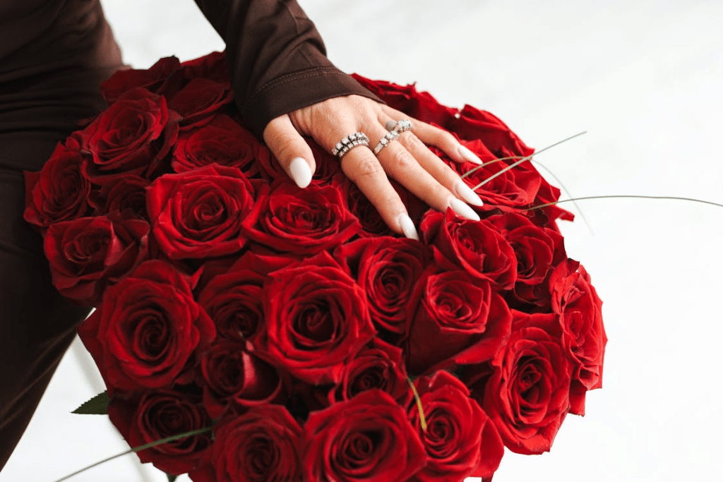 A woman touching the roses