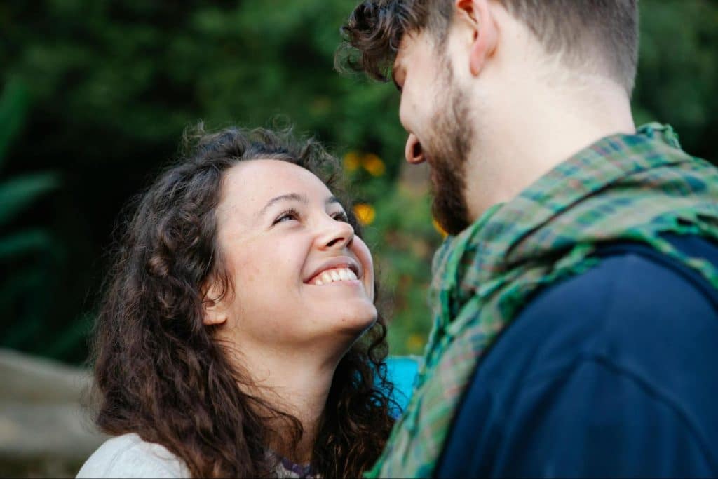 A man and woman smiling at each other