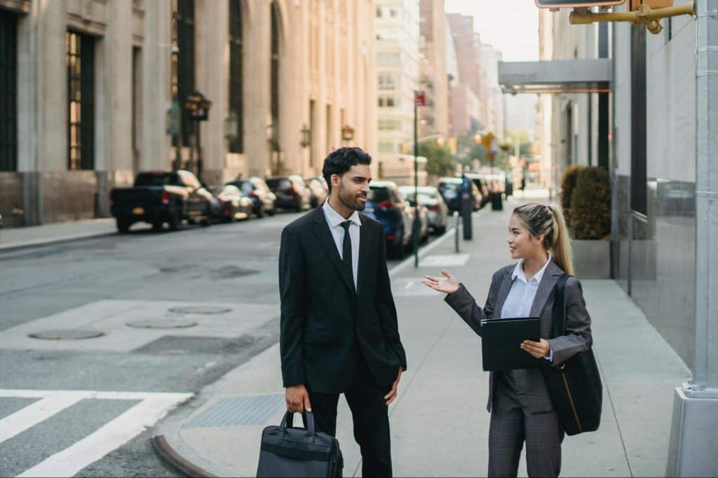 A man and woman walking outside