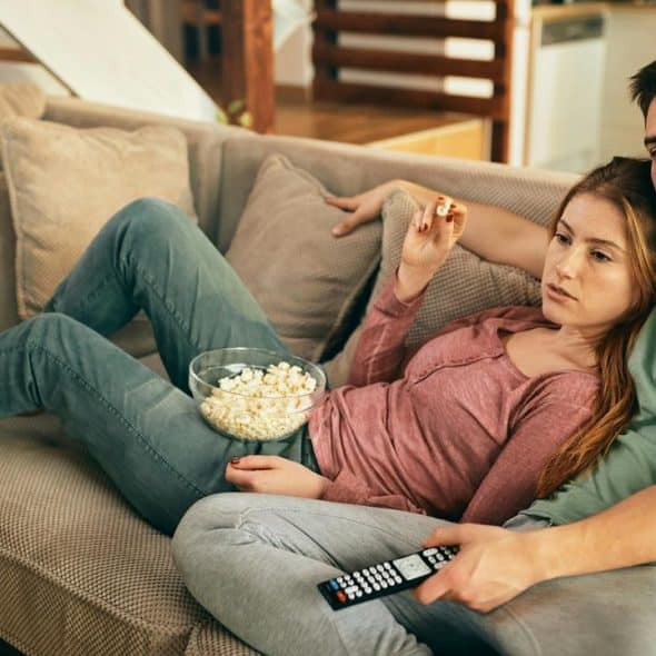 A couple relaxing on a couch