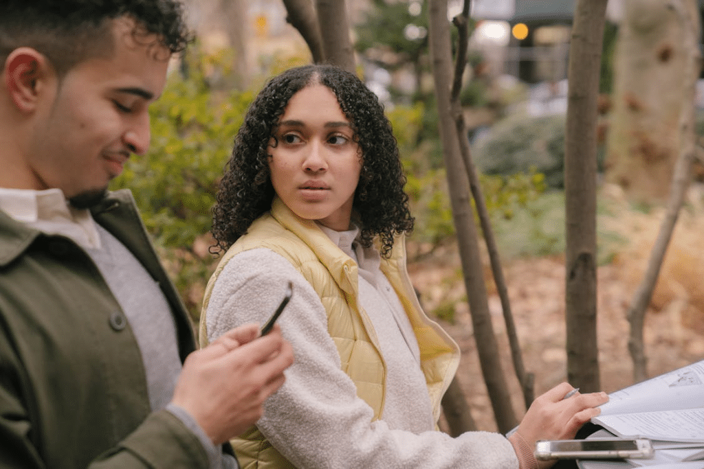A woman looking at the man