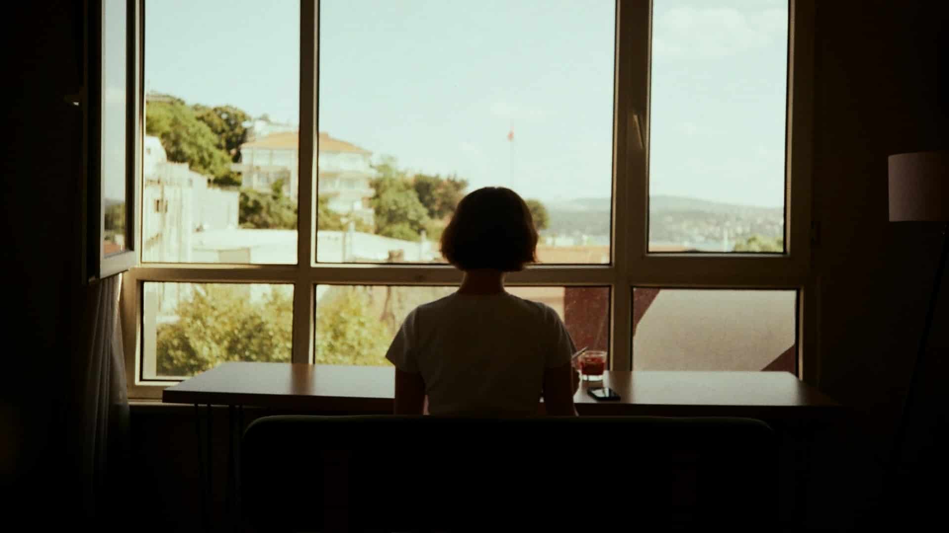 A woman looking out the window.