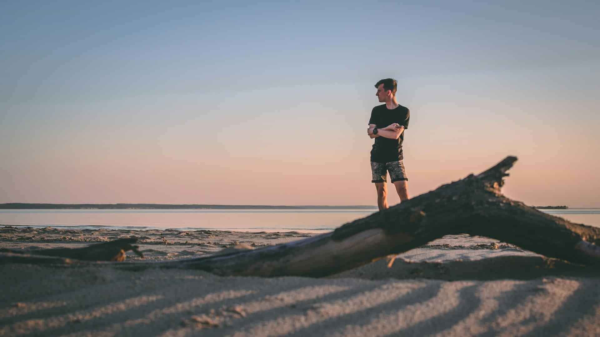 A man standing near the shore