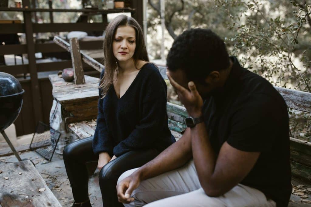 Woman crying while talking to a man