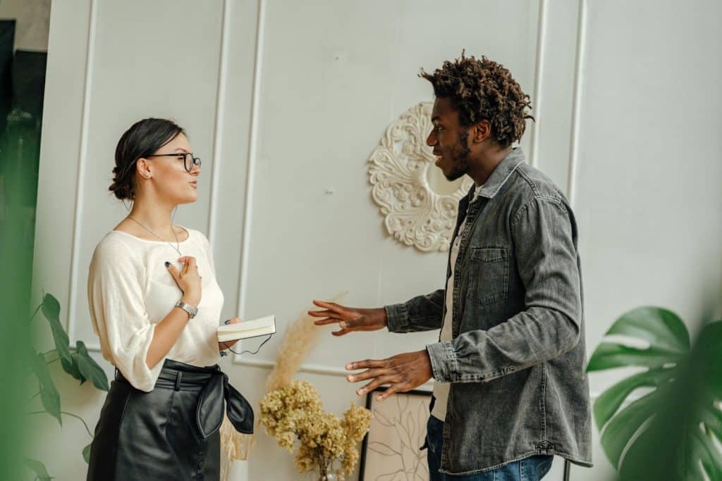 Woman talking to a man