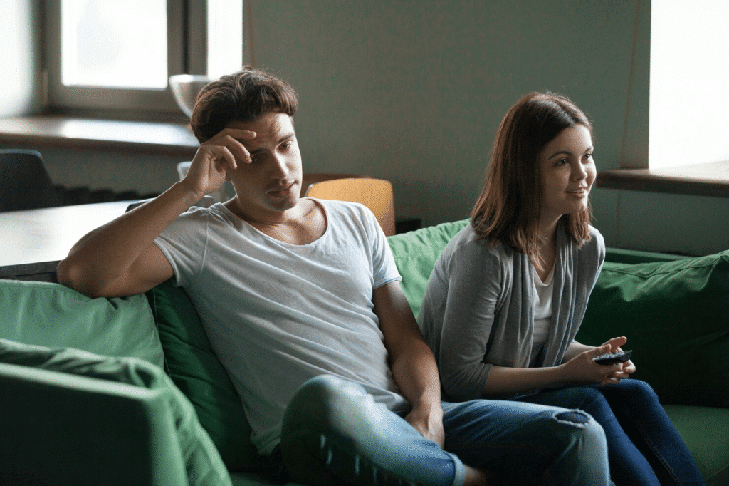 A couple sitting on a sofa