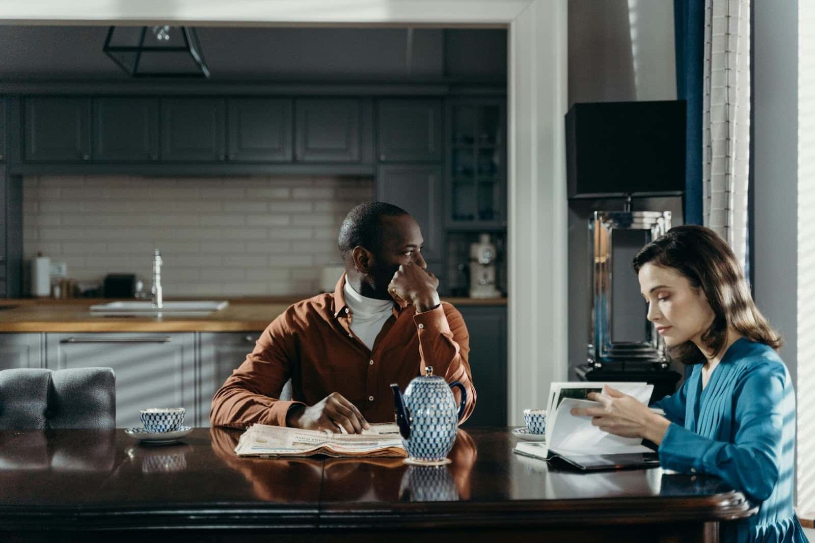 A man and woman at the same room but not talking to each other