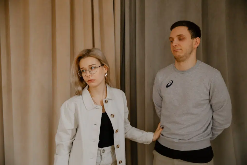 Man Standing Beside Woman Feeling Disappointed