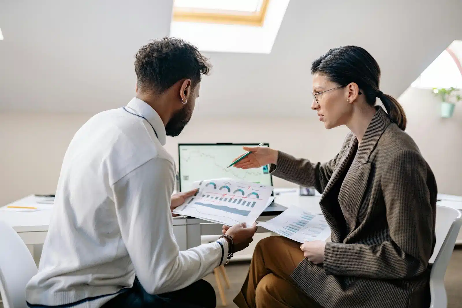 A woman nagging a man about work