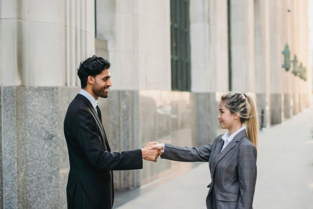 A man and woman shaking hands