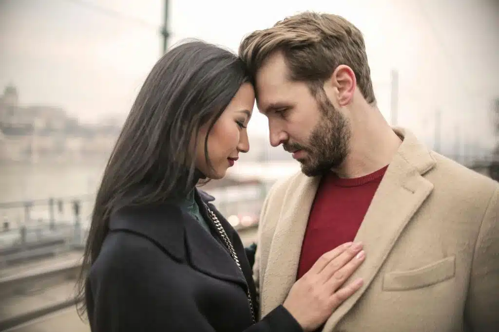 A man and woman facing each other
