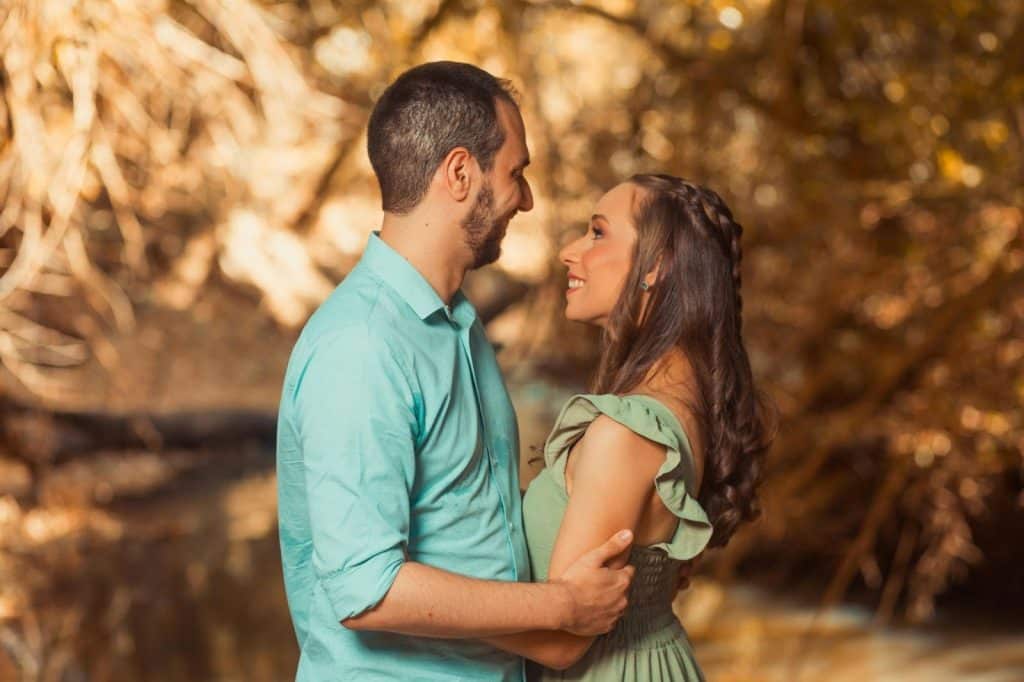 A man and woman facing each other