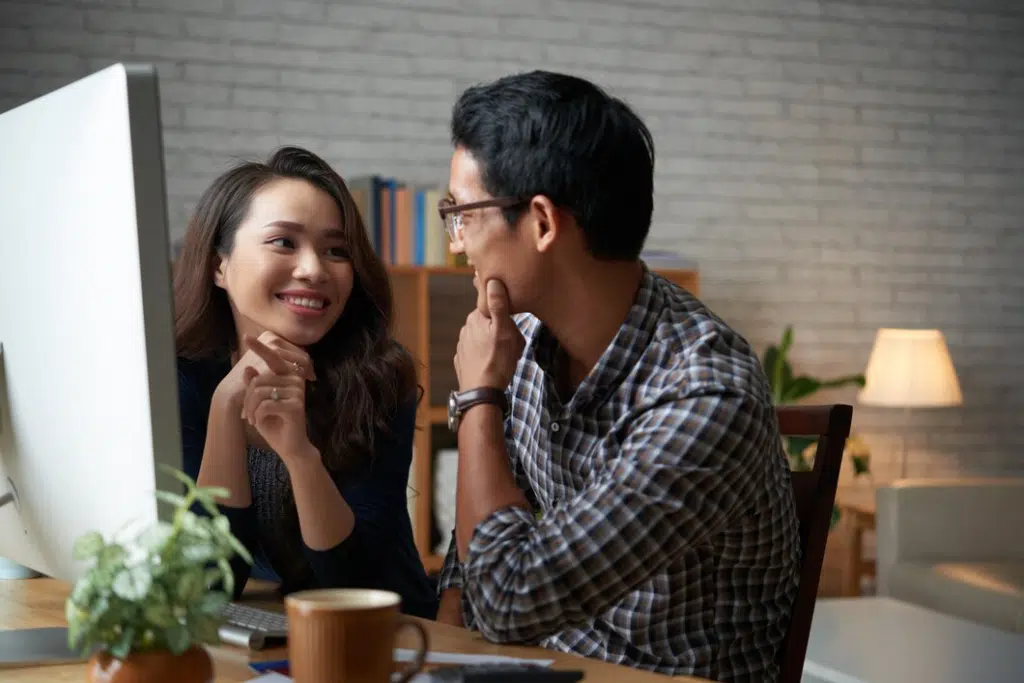Two people looking at each other in cafe