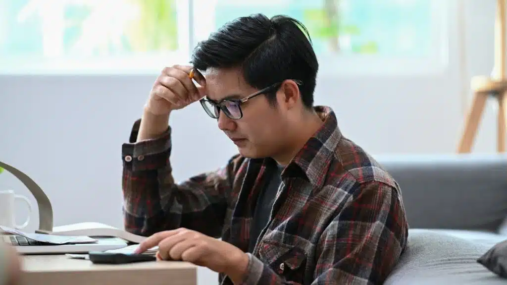 man paying bills home