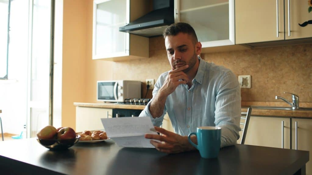 man thinking at home