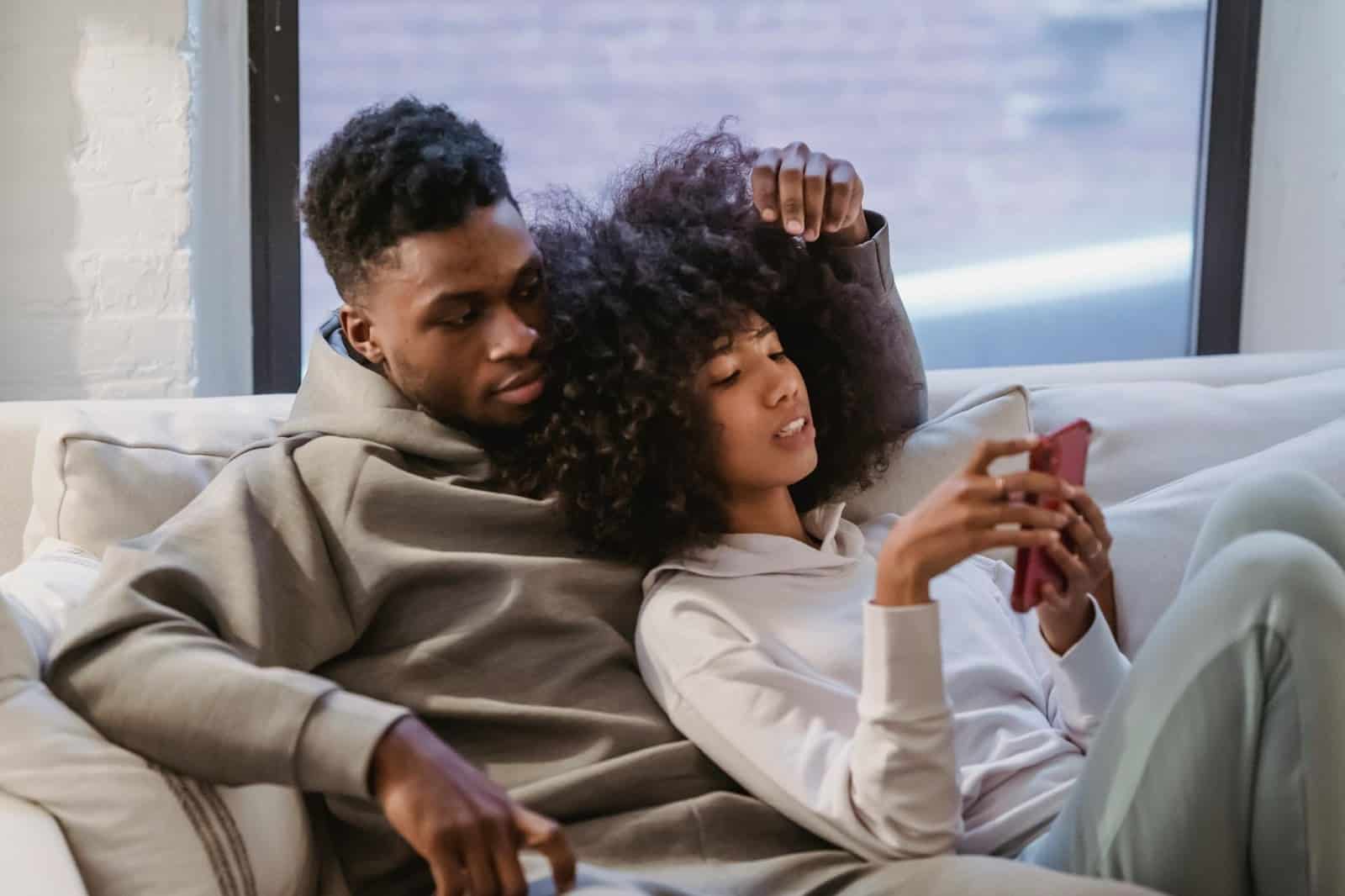 Woman using a phone and watching her