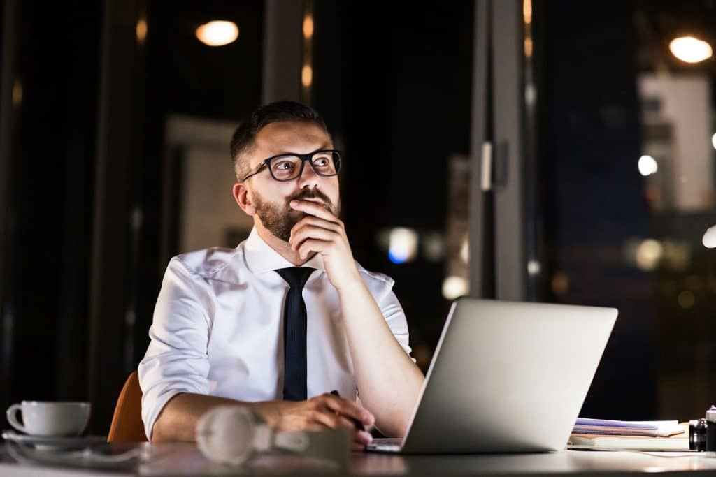 man working late office