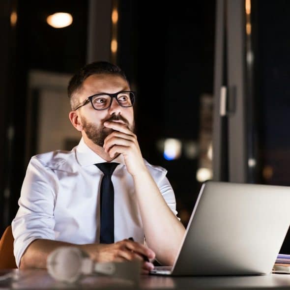 man working late office