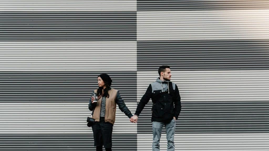 A man and a woman holding each other's hand.