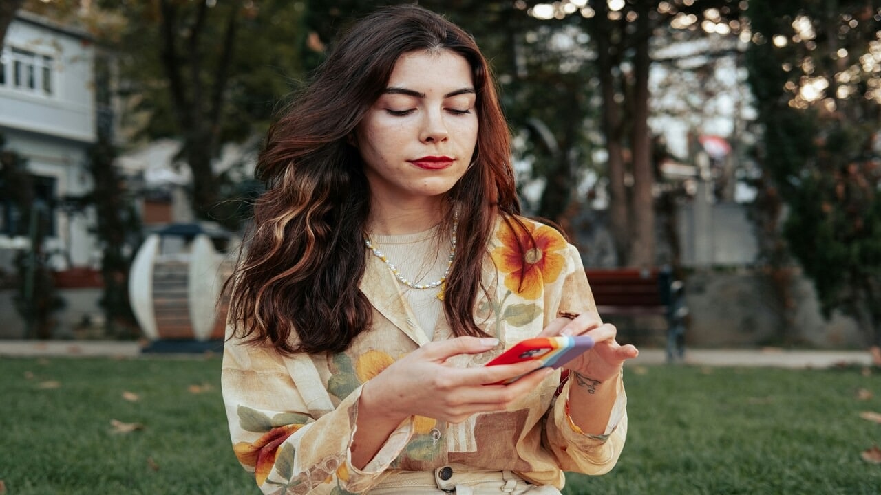 A woman waiting for a text