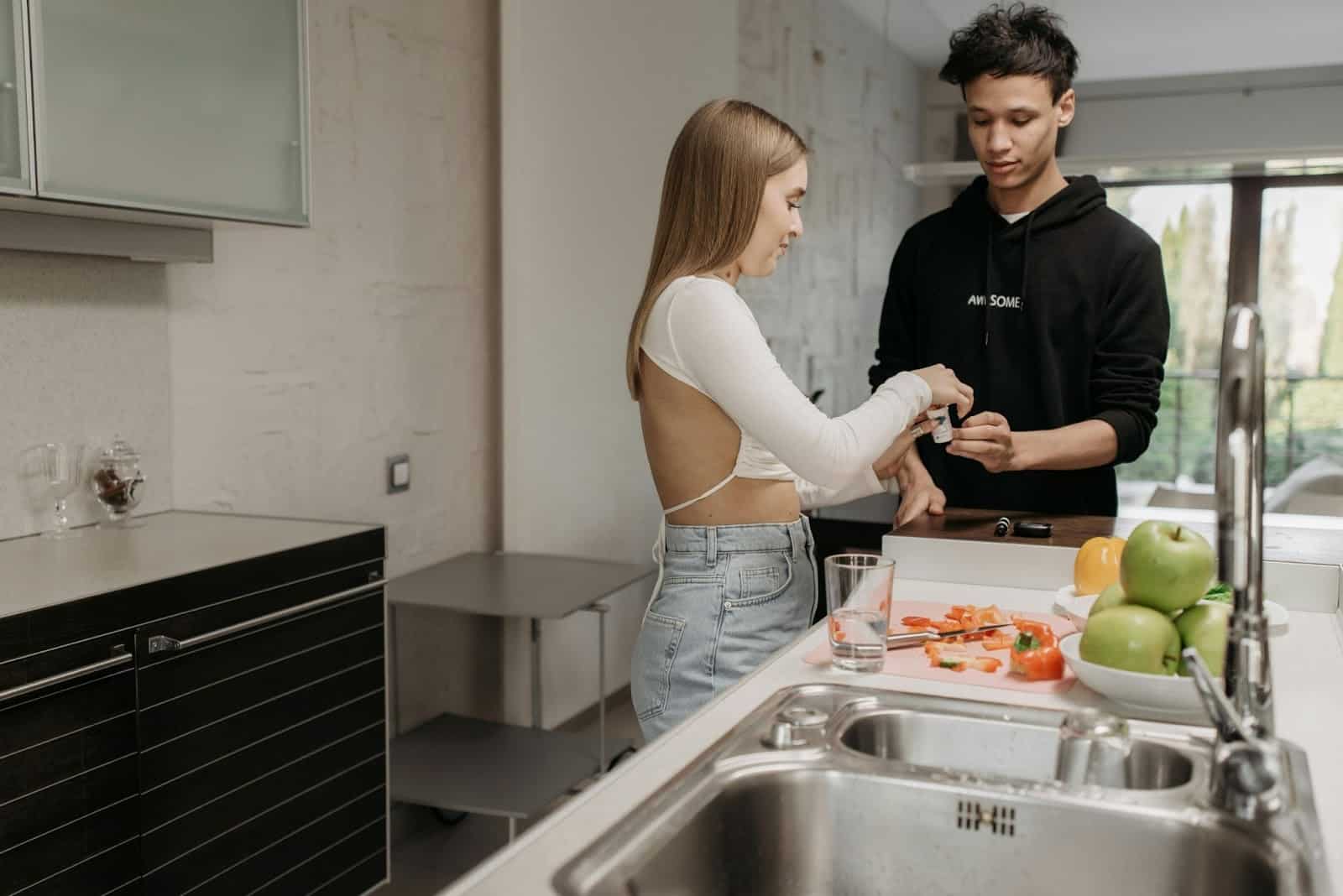 A woman instructing a man what to do
